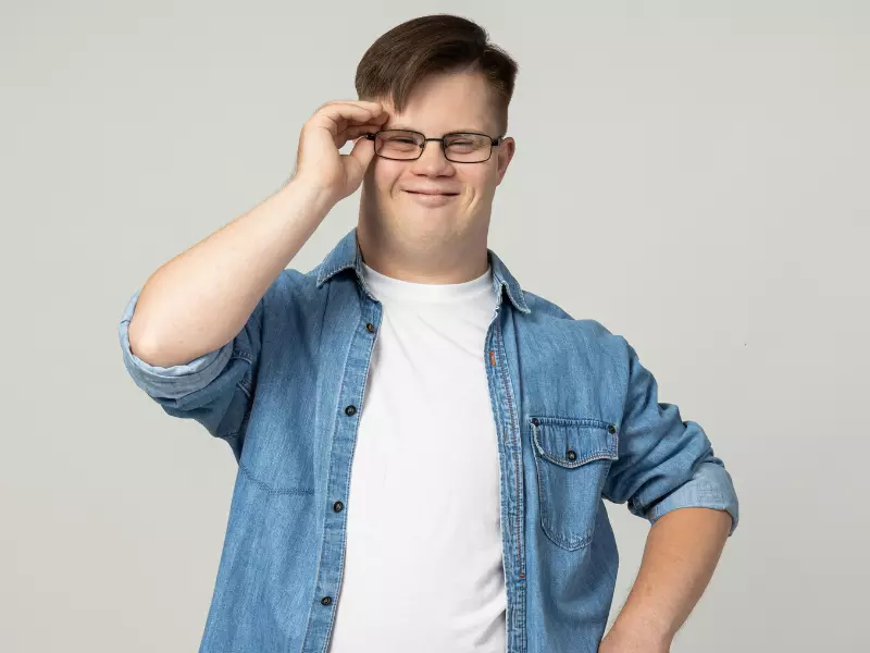 Disabled man with down syndrome smiling at the camera